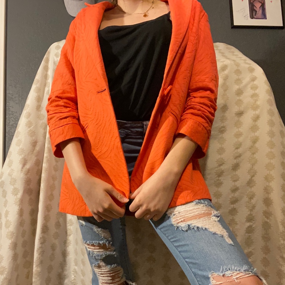 Orange blazer.